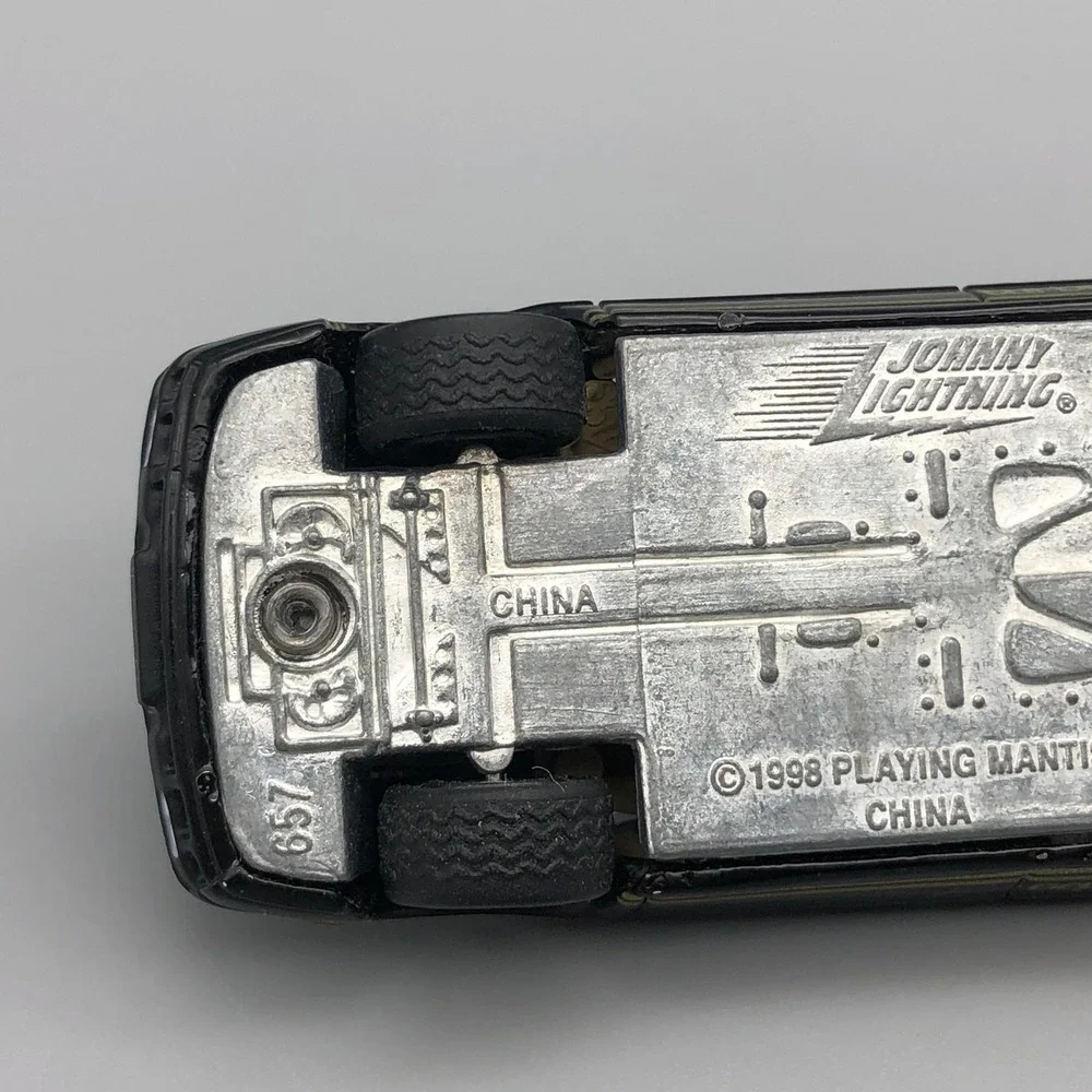 Johnny Lightning 1977 Lotus Esprit Turbo S1 Diecast Car Black Diecast 1/64 Scale